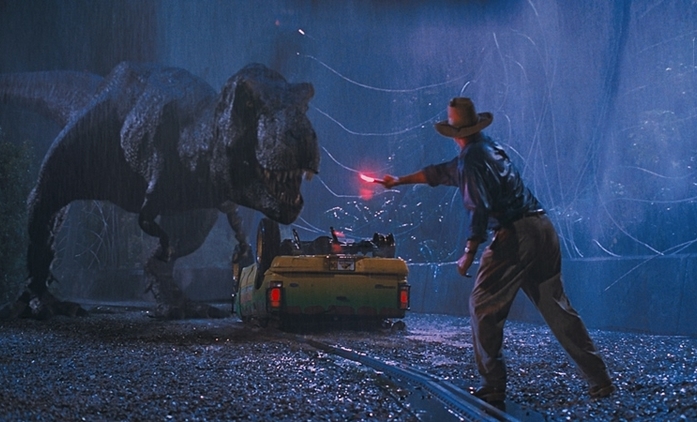 Doktor Grant zahánějící Tyranosaura Rexe ve filmu Jurský park